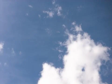 Bright Cloud Cluster Below a Broad Blue Sky Stock Photos