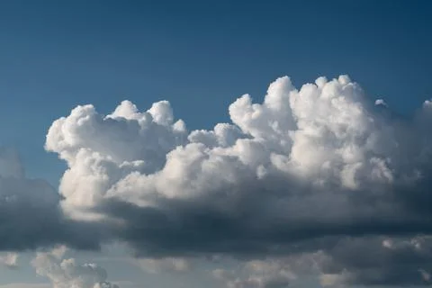 Bright cloud on deep blue sky Stock Photos