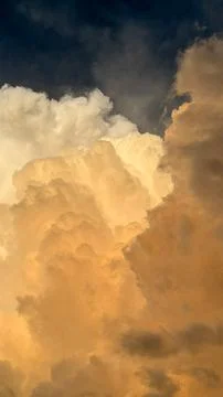Bright clouds form in the sky during the evening with shades of orange and .. Photos