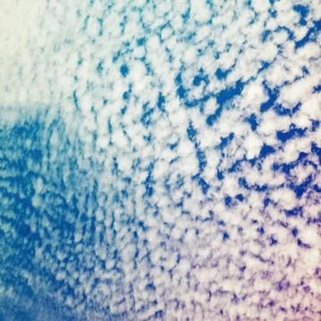 Bright cloudy sky, stylized square background 写真素材