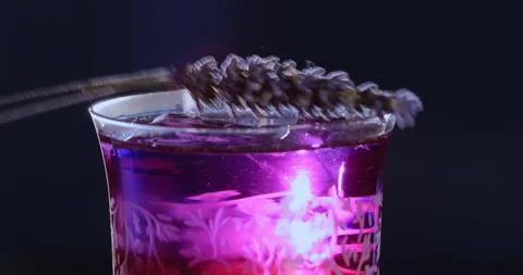 Bright cocktail on a black background. Stock Footage 228676987