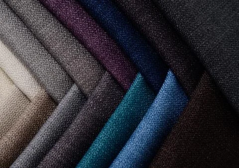 Bright collection of gunny textile samples. Fabric texture background. Stock Photos