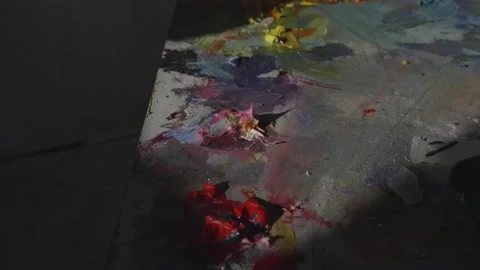 Bright color paint spread over palette in art studio closeup Stock Footage 132771124