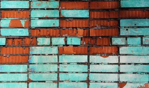 Bright colored background of destroyed brick wall Stock Photos