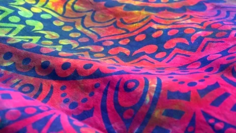 Bright colored fabric ethnic pattern mandala fluttering in the wind. Close-up Stock Footage 120999057