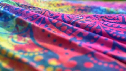 Bright colored fabric ethnic pattern mandala fluttering in the wind. Close-up Stock Footage 120999135
