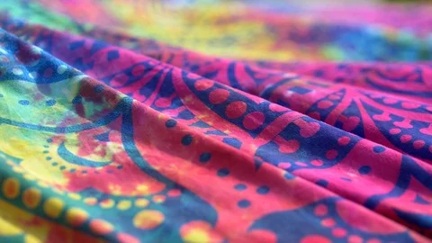 Bright colored fabric ethnic pattern mandala fluttering in the wind. Close-up Stock Footage 120999223