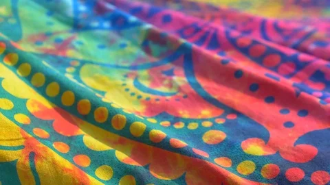 Bright colored fabric with an ethnic pattern mandala fluttering in the wind. Stock Footage 120999343