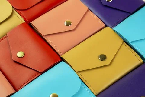Bright colored leather wallets lie tightly to each other. close-up Stock-Fotos