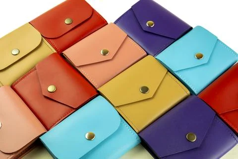 Bright colored leather wallets lie tightly to each other. close-up on a whi.. Foto stock
