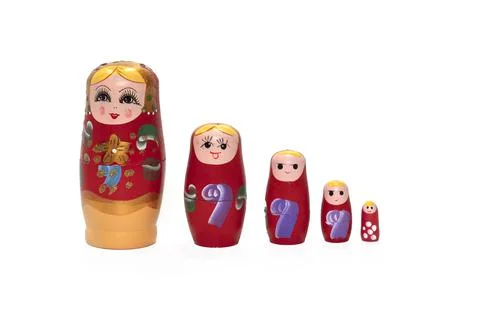 Bright colored nesting dolls on a white background. Russian national souvenir Stock Photos