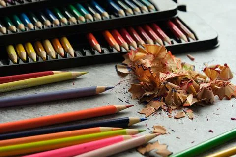 Bright colored pencils on a gray background Stock-Fotos