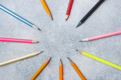 Bright colored pencils on the grey table. concept school. Copy space Stock-Fotos