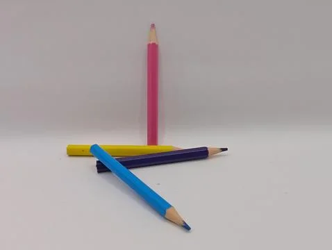 Bright colored pencils on a white background, close-up composition Stock Photos