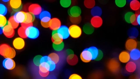 Bright colored round lights on black background. Shiny texture Stock Footage 100303673