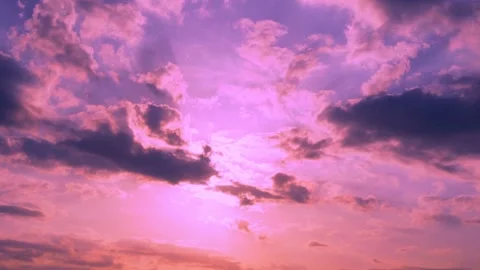 Bright Colored Sunset Orange Pink Blue Sky Sun Sunlight Sun Rays Beams and Storm 库存影片 330581594