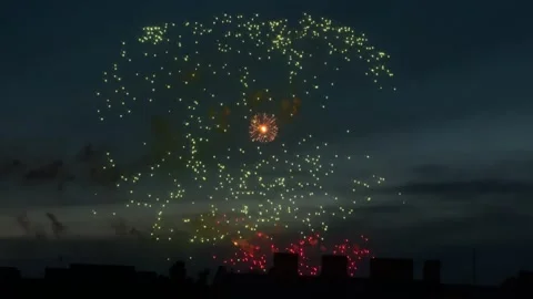 Bright colorful fireworks exploding against dark night sky Stock Footage 339789612