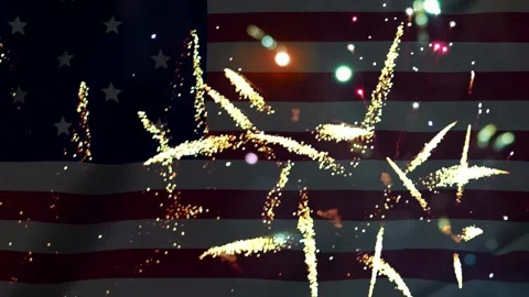 Bright colorful fireworks exploding in front of a waving american flag back.. 库存影片 343690259
