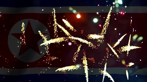Bright colorful fireworks exploding in front of the north korea national fl.. Video stock 343690300