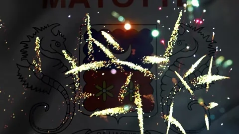 Bright colorful fireworks exploding in front of the official mayotte flag s.. Видео 343690308