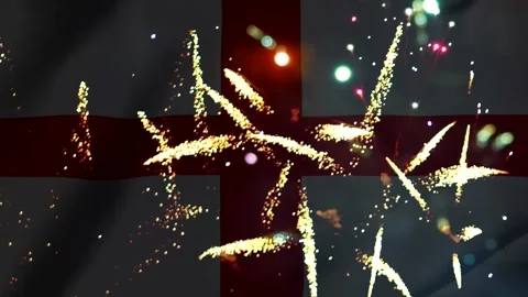 Bright colorful fireworks exploding in front of the waving flag of England Video stock 343690315