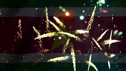 Bright colorful fireworks exploding in front of the suriname national flag .. Video stock 343690325