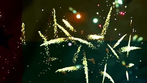 Bright colorful fireworks exploding in the night sky over a blurred nationa.. Видео 343690348
