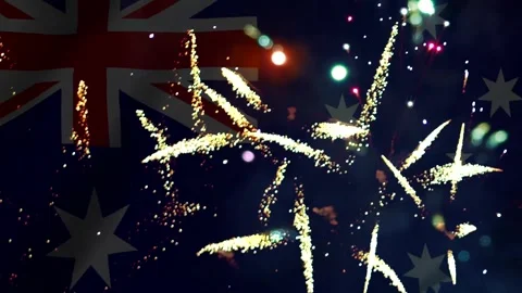 Bright colorful fireworks exploding in the night sky over the australian fl.. Видео 343690371