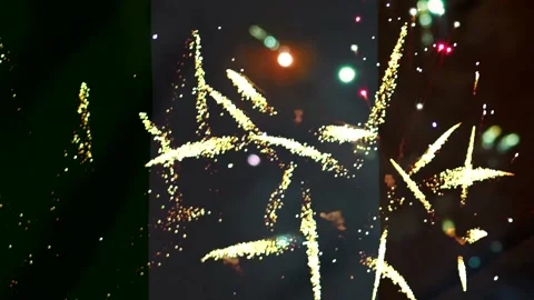 Bright colorful fireworks exploding in the night sky over the national flag.. Video stock 343690412