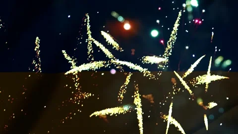 Bright colorful fireworks exploding in the night sky over the yellow and bl.. Vídeos de archivo 343690421