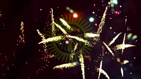 Bright colorful fireworks exploding in the night sky with the superimposed .. Stock Footage 343690443