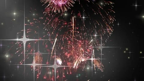 Bright colorful fireworks exploding in the night sky with animated sparkling Stock Footage 345852760
