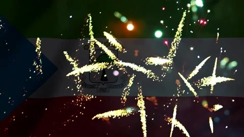 Bright colorful fireworks exploding over the national flag of equatorial gu.. Stock Footage 343690476
