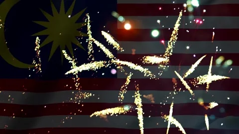 Bright colorful fireworks exploding over the waving flag of Malaysia celebr.. Video stock 343690549