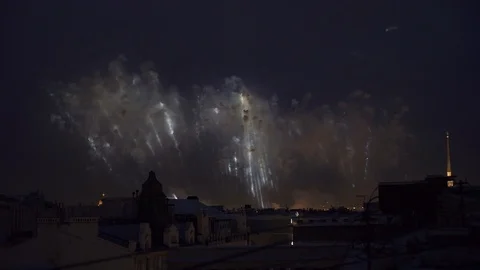 Bright colorful flashes in dark cloudy sky. View at fireworks from building. Video stock 92370446