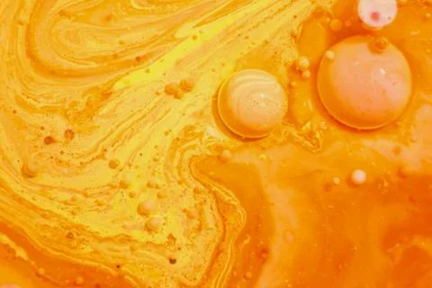 Bright colorful orange bubbles on the surface of the water. Abstract paint bu イラスト素材