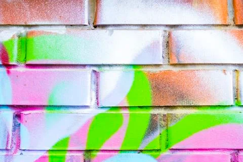 Bright coloring on a brick wall background. 스톡 사진