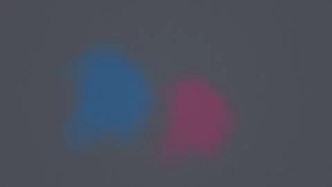 Bright colors blend in soft motion on a simple dark Stock Footage 338166928