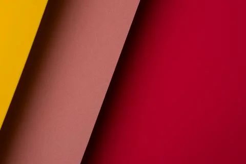 Bright colors create a pattern with yellow, brown, and red paper layered to.. Stock Photos