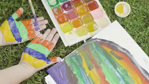 Bright colors on the hands Stock Footage 134812860