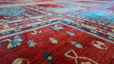 Bright colors on a patterned rug in a mosque Stock Footage 340244385