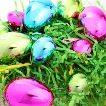 Bright colourful easter eggs on straw Foto stock