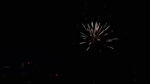 Bright colourful firework explosion on dark night sky over big city illumination Vidéo 147371405