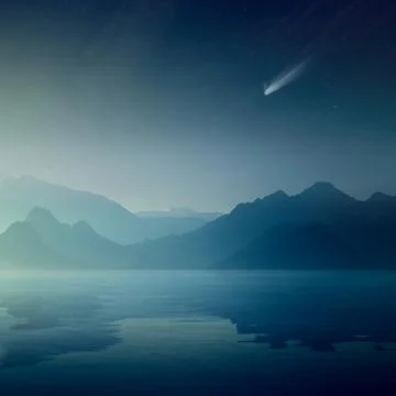 Bright comet and stars in dark blue sky, silhouettes of mountains reflected i Stock Photos