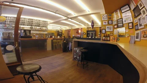 Bright Craft Beer Bar Interior with Wooden Counter and Menu Boards Stock Footage 344957590