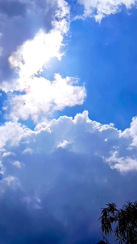 Bright Cumulus Clouds in Blue Sky with Strong Sunlight During Daytime Stock Footage 328486321