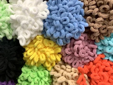 Bright curly multicolored background from a set of plush loopels of yarn for Stock Photos