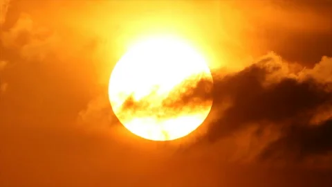 Bright disk of sun in hot sunset sky Stock Footage 161474555