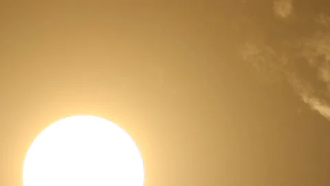 Bright disk of sun through condensed clouds 스톡 동영상 122611616