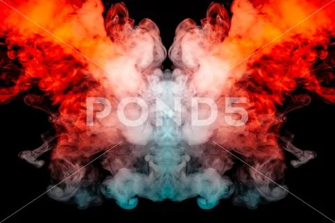 The bright dynamic pattern of explosive fiery smoke illuminated in blue orang Stock Photos